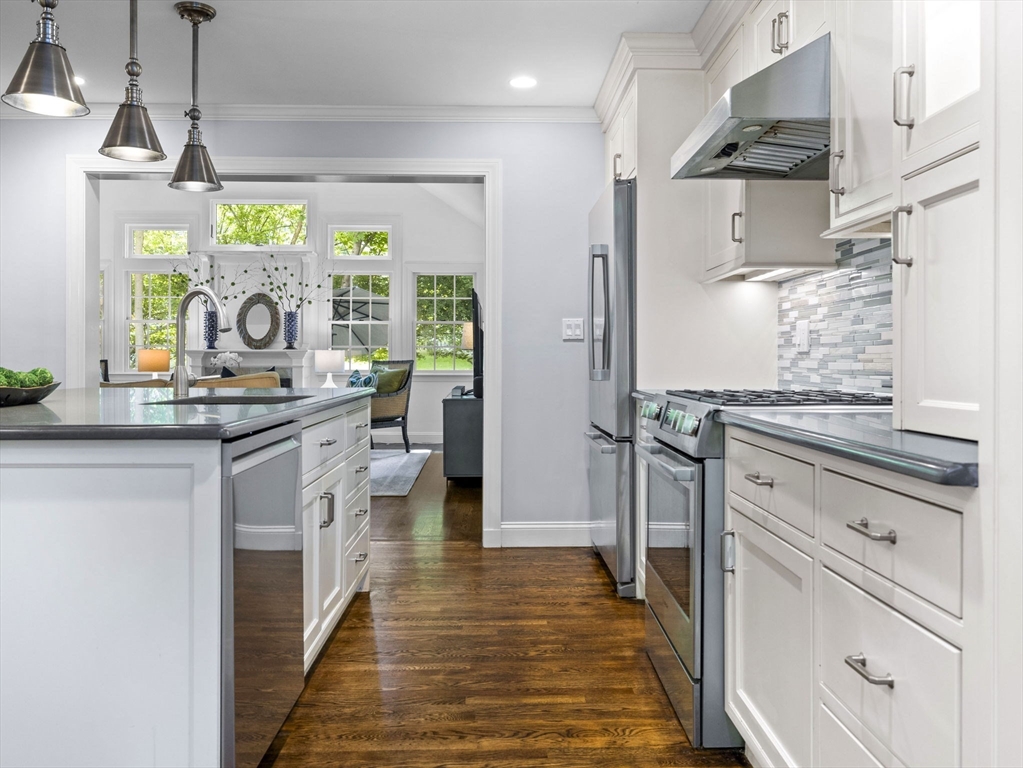 3 Dudley Road Wellesley, MA 02481 - Photo 6 of 25 a kitchen with stainless steel appliances granite countertop a stove and a refrigerator