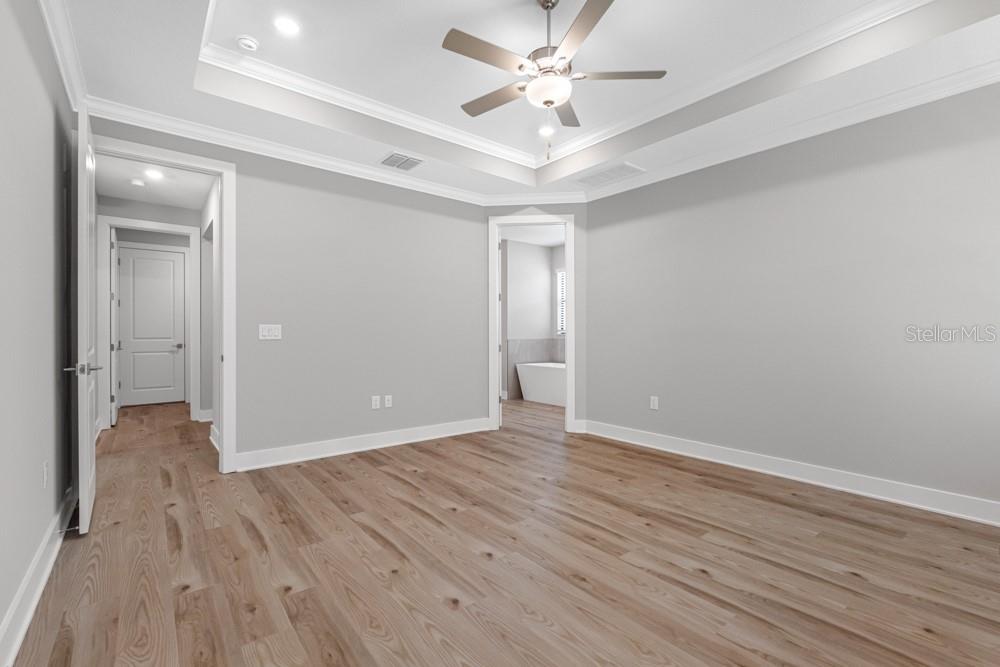 13510 Haflinger Way Hudson, FL 34667 - Photo 12 of 13 a view of an empty room with wooden floor