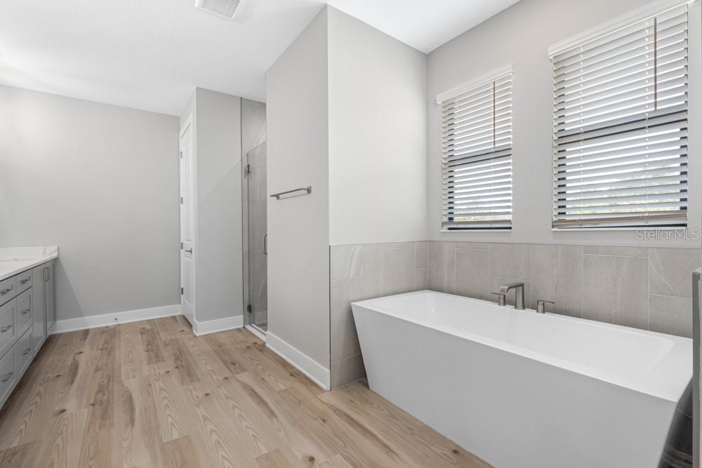 13510 Haflinger Way Hudson, FL 34667 - Photo 13 of 13 a bathroom with a bathtub and a sink