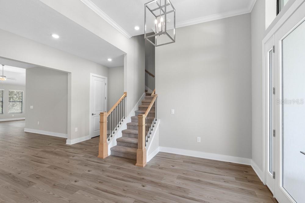 13510 Haflinger Way Hudson, FL 34667 - Photo 5 of 13 a view of entryway with wooden floor