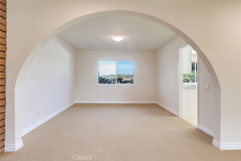 15750 Pounders Drive Riverside, CA 92504 - Photo 23 of 51 an empty room with windows
