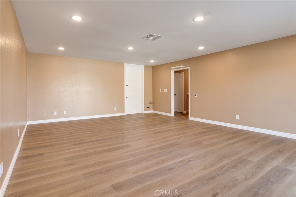15750 Pounders Drive Riverside, CA 92504 - Photo 27 of 51 a view of an empty room with wooden floor