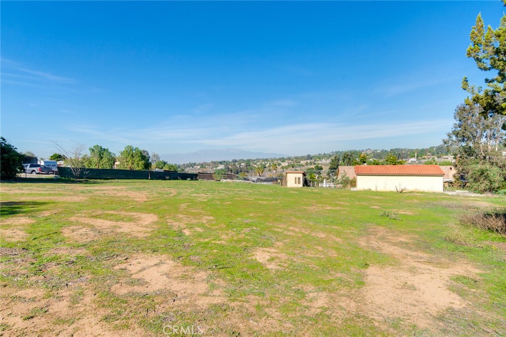 15750 Pounders Drive Riverside, CA 92504 - Photo 41 of 50 Lower rear yard viw. Work Shop with rolling door at left