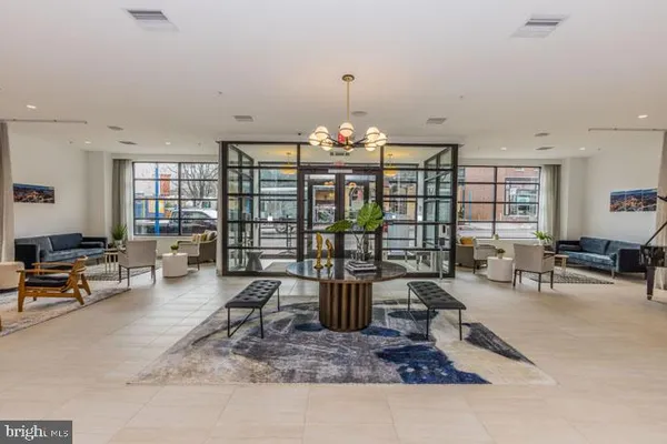 a kitchen with stainless steel appliances kitchen island granite countertop a stove a sink and a microwave