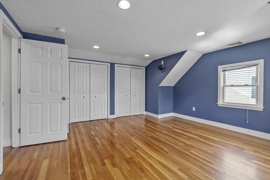 97 Hartwell Road Bedford, MA 01730 - Photo 17 of 42 a view of an empty room with wooden floor