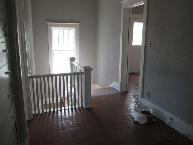 a view of a porch with wooden floor