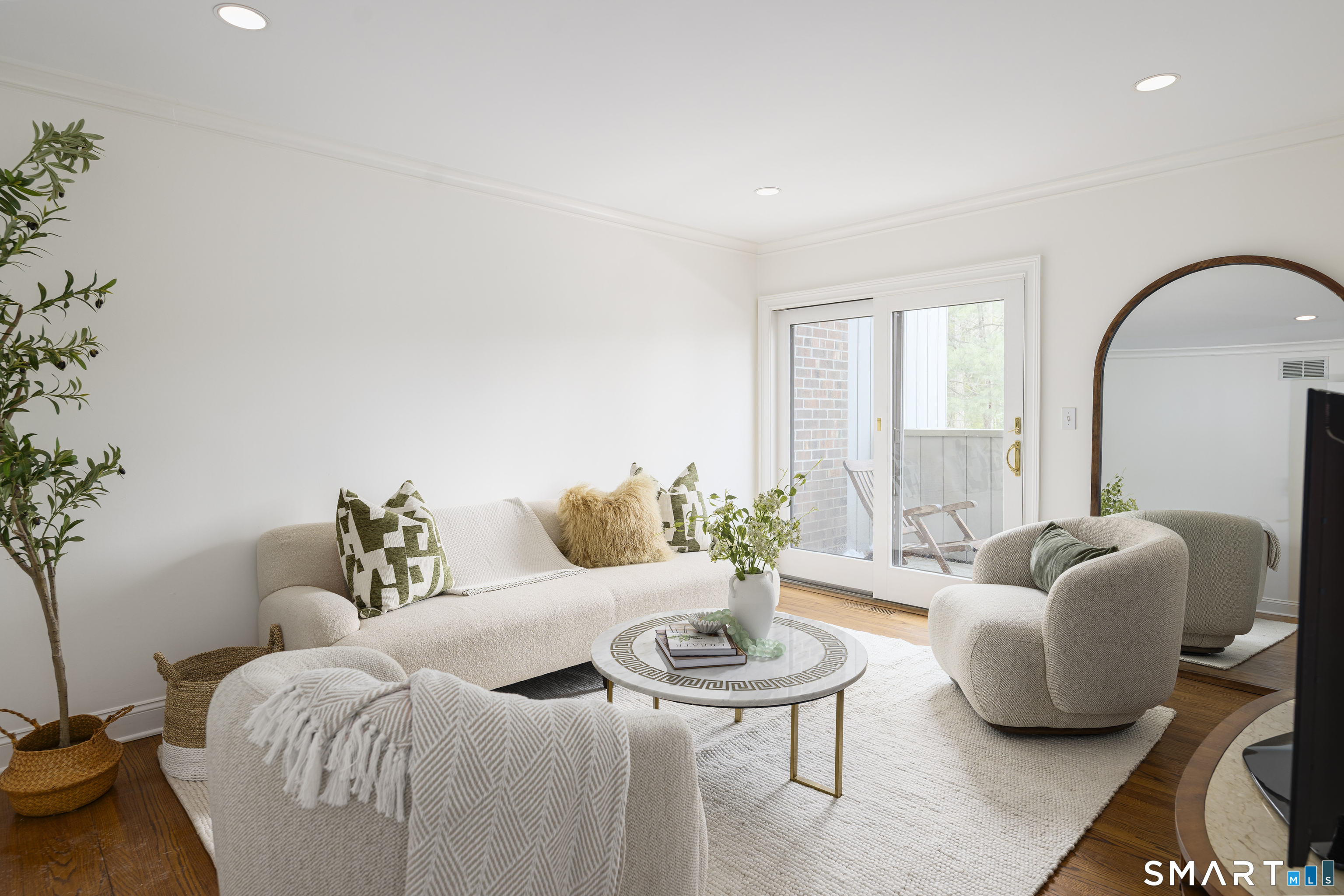 377 Main Street, Unit 17 New Canaan, CT 06840 - Photo 6 of 19 Even the family room has access to the outside at this Kings Grant condo