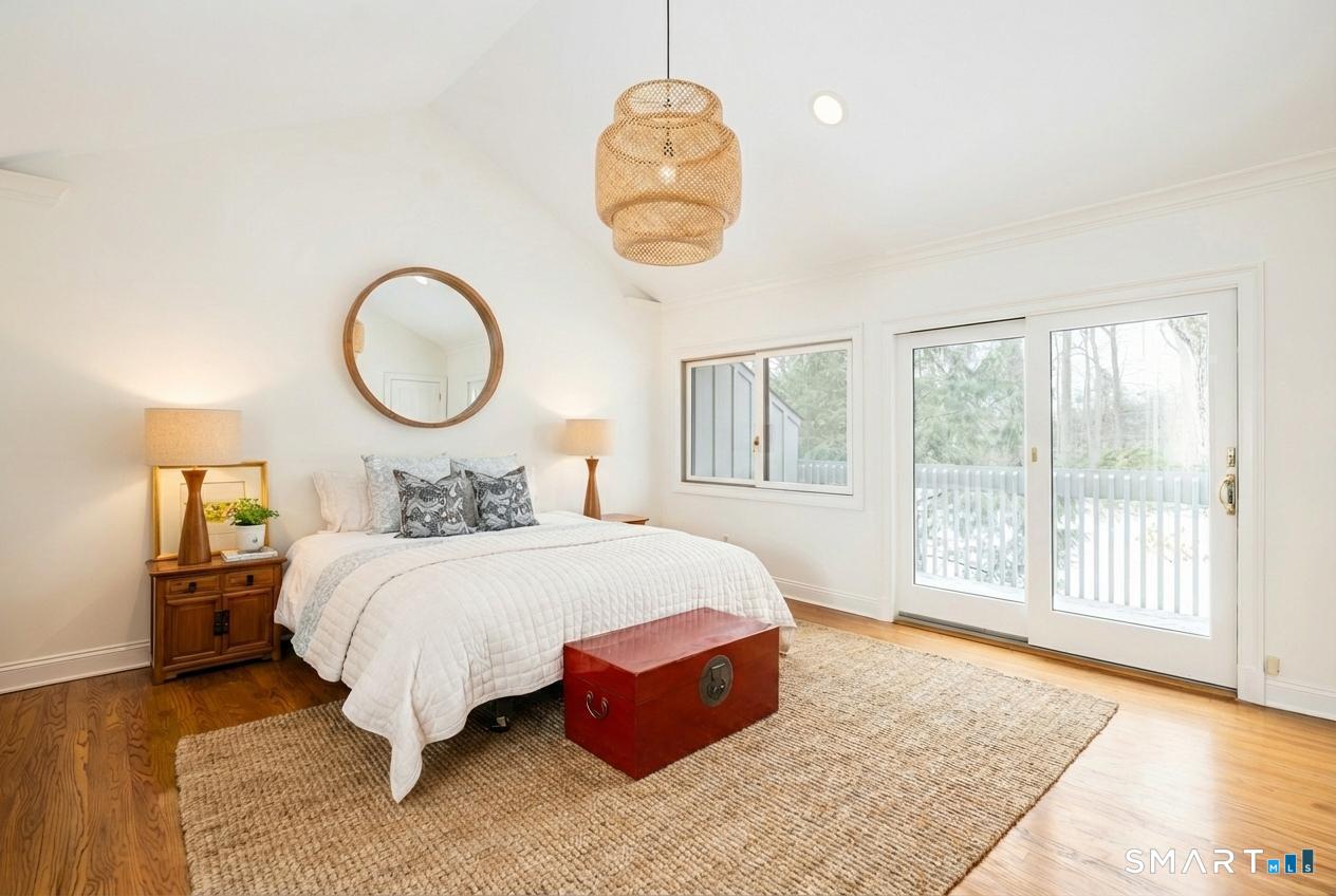 377 Main Street, Unit 17 New Canaan, CT 06840 - Photo 8 of 19 Primary suite has a private deck, large walk in closet, en suite bathroom and a cathedral ceiling