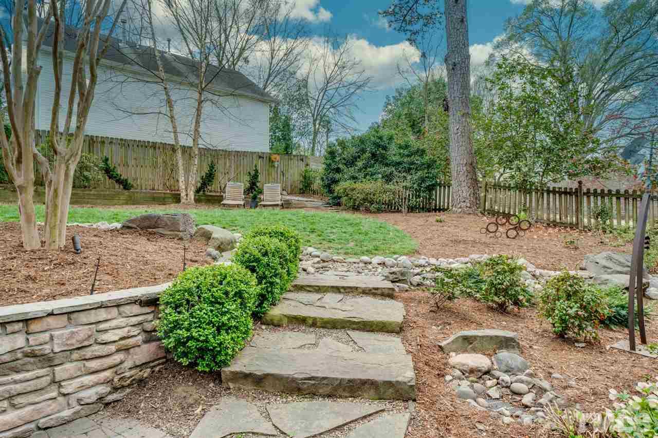 2607 Van Dyke Avenue Raleigh, NC 27607 - Photo 14 of 26 a view of a patio with a table and chairs under an umbrella