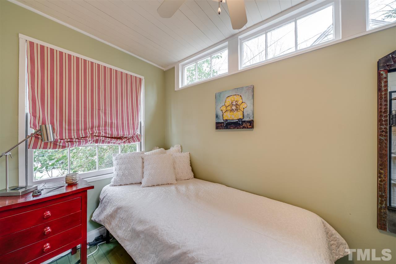 2607 Van Dyke Avenue Raleigh, NC 27607 - Photo 23 of 26 a bedroom with a bed and a window