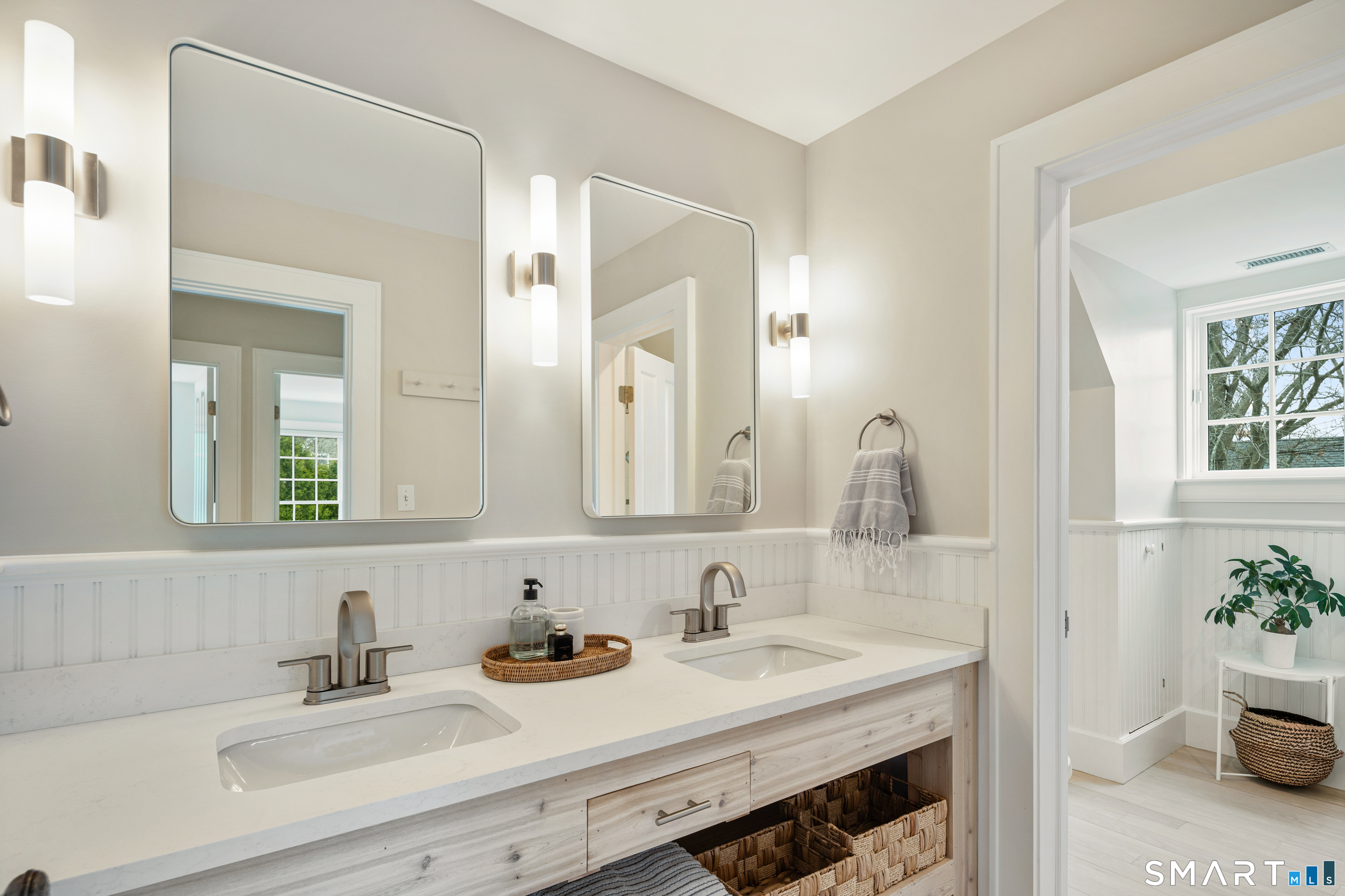 50 Roton Avenue Norwalk, CT 06853 - Photo 24 of 32 Bathroom with dual sinks and custom vanity.
