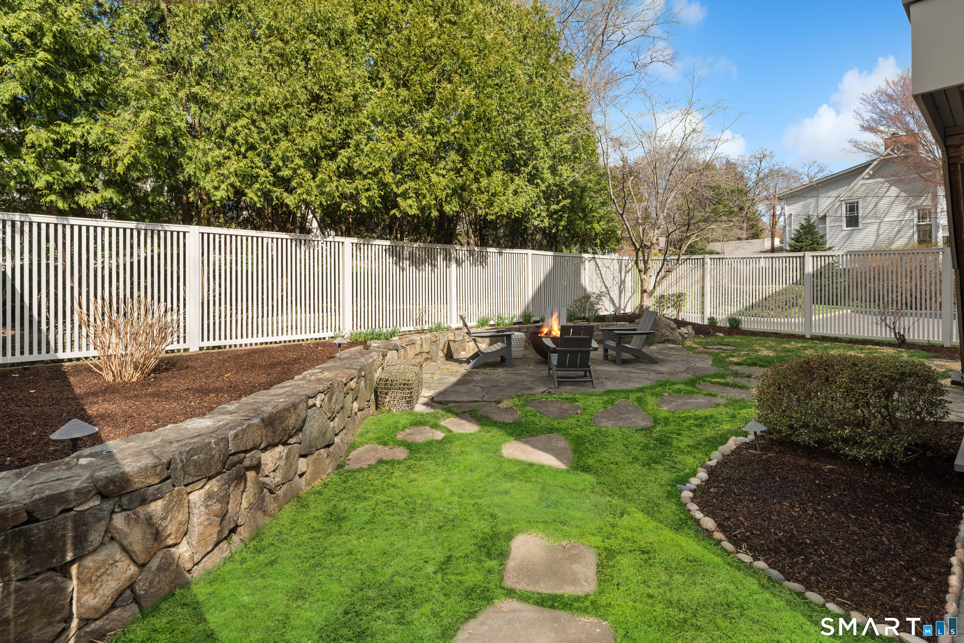50 Roton Avenue Norwalk, CT 06853 - Photo 30 of 32 Backyard with new fencing, patio, and blue stone walkway