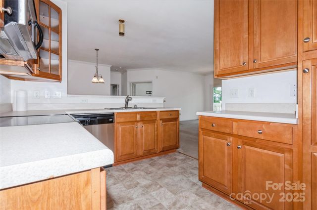 a kitchen that has a sink and a stove