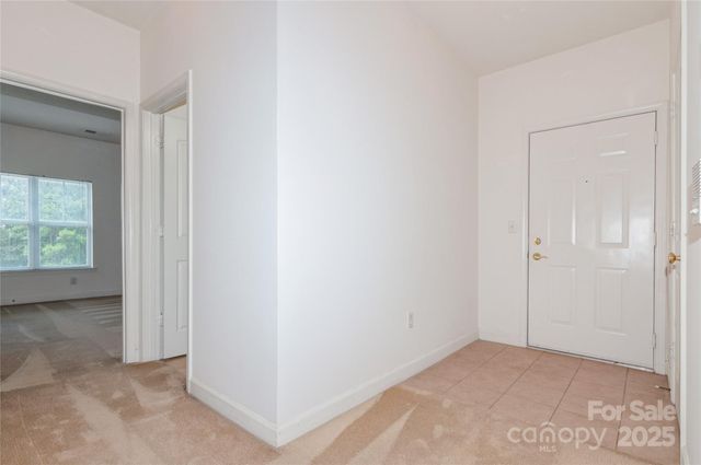 a view of an empty room and a window