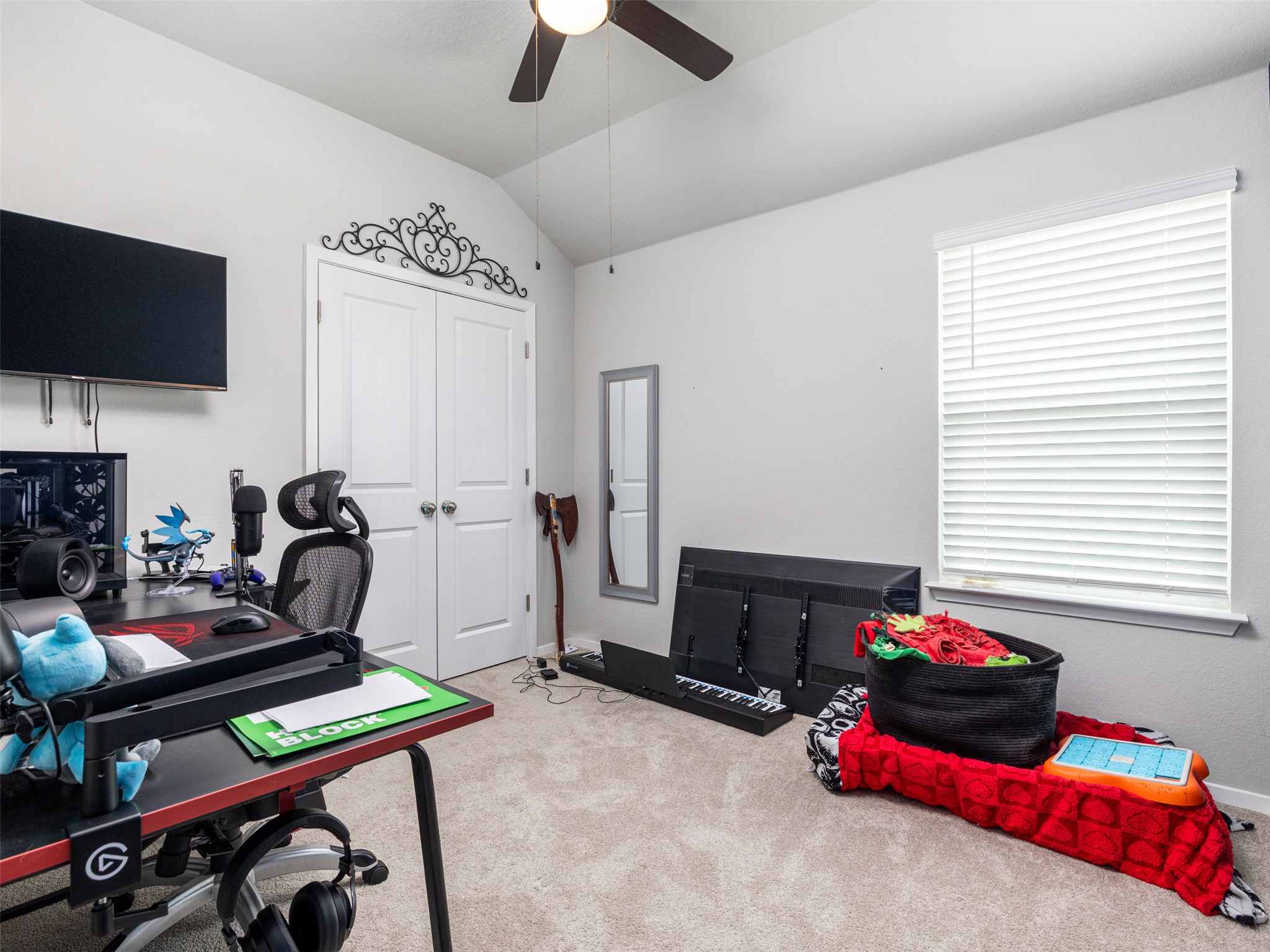 121 Graver Street Georgetown, TX 78626 - Photo 15 of 28 Well-lit room features soft carpeting and convenient closet access.