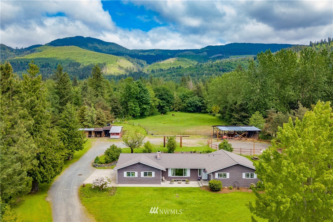 6820 Goodwin Road Everson, WA 98247 - Photo 1 of 34 an aerial view of a house with swimming pool garden and mountain view
