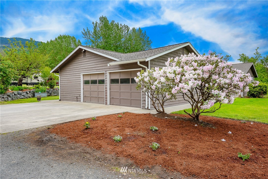 6820 Goodwin Road Everson, WA 98247 - Photo 2 of 34 a house with trees in the background