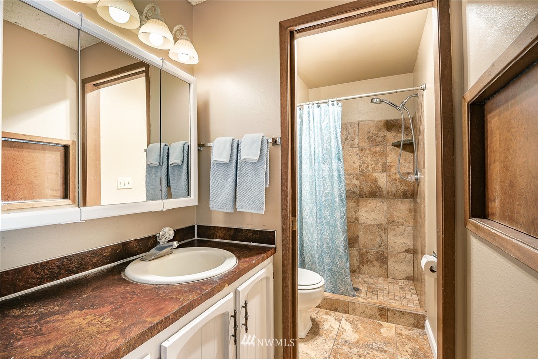 6820 Goodwin Road Everson, WA 98247 - Photo 12 of 34 a bathroom with a sink double vanity and a mirror