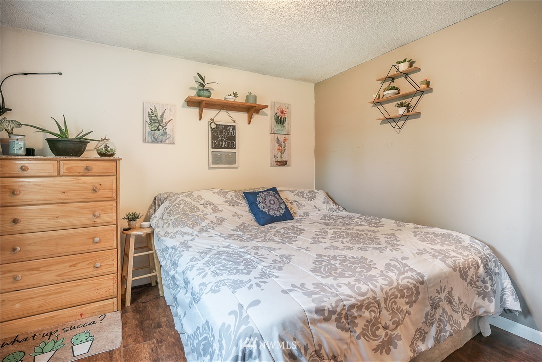 6820 Goodwin Road Everson, WA 98247 - Photo 14 of 34 a bedroom with a bed and a dresser