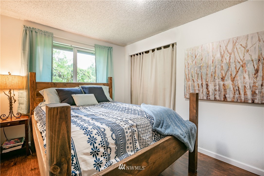 6820 Goodwin Road Everson, WA 98247 - Photo 15 of 34 a bed sitting in a bedroom next to a window