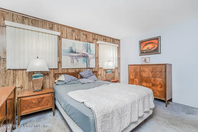 a bedroom with a bed and a cabinets