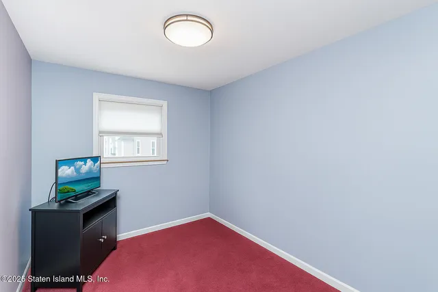a bathroom with a sink mirror vanity and toilet