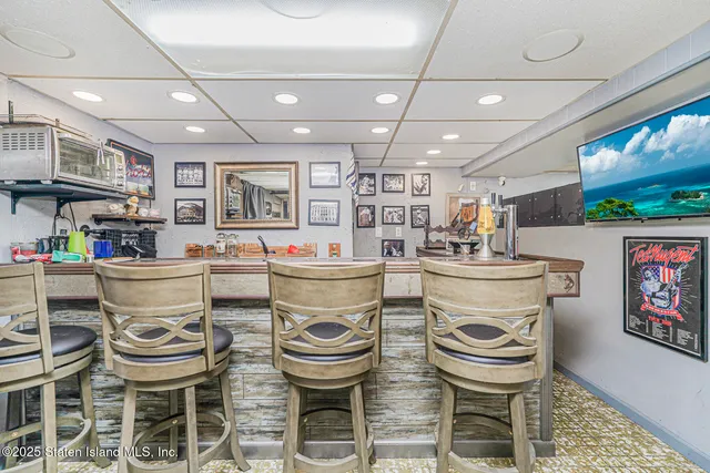 a kitchen with a table and chairs