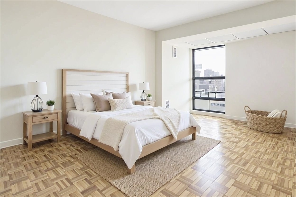 566 Commonwealth Avenue, Unit 706 Boston, MA 02215 - Photo 5 of 9 a bedroom with a bed and a window