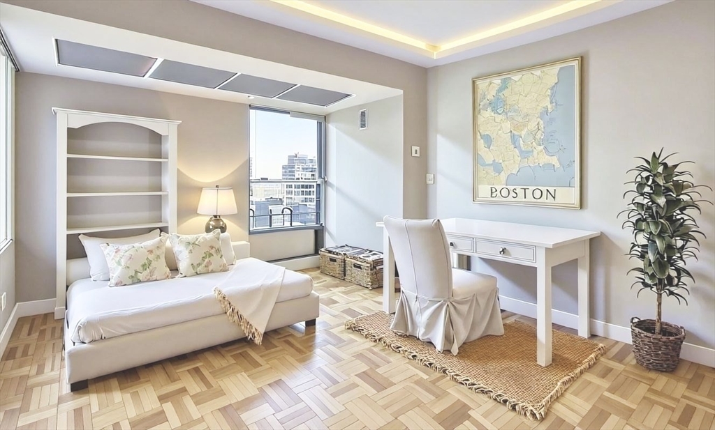 566 Commonwealth Avenue, Unit 706 Boston, MA 02215 - Photo 6 of 9 a living room with furniture and a large window