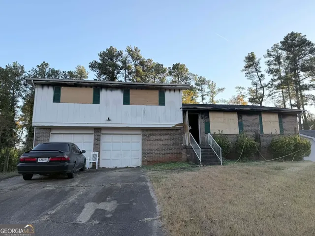 a view of a car parked in front of a house