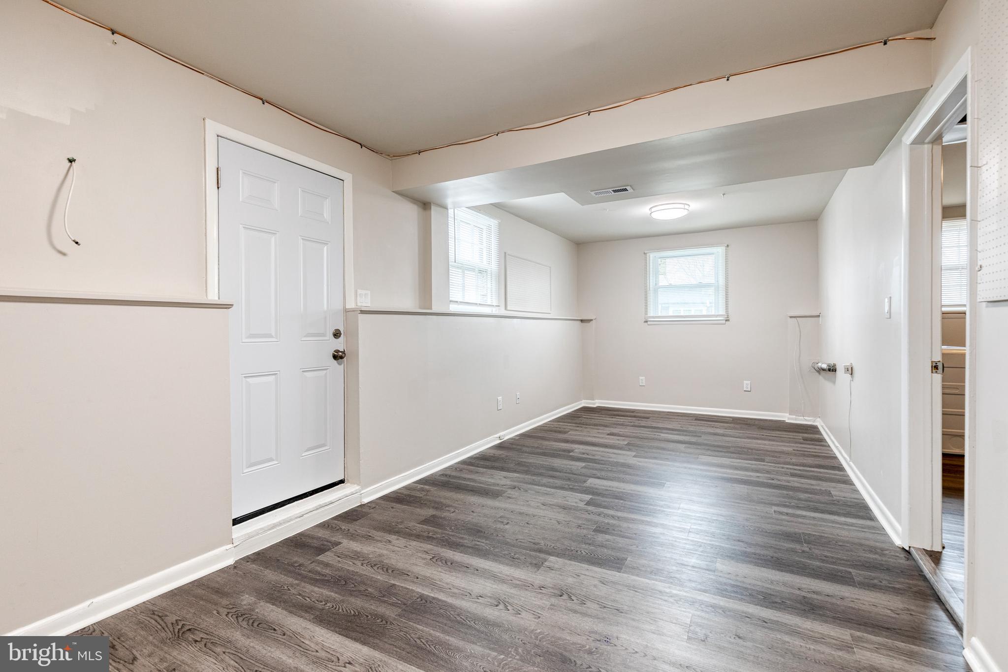 3719 Brenbrook Drive Randallstown, MD 21133 - Photo 22 of 24 a view of empty room with wooden floor and fan
