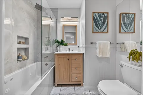 a bathroom with a sink a vanity and a mirror