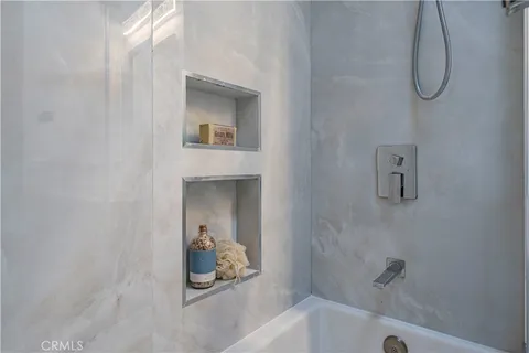 a bathroom with a bath tub