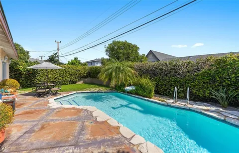 a view of a backyard with sitting area
