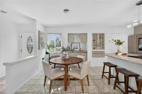 a view of a dining room with furniture and a table
