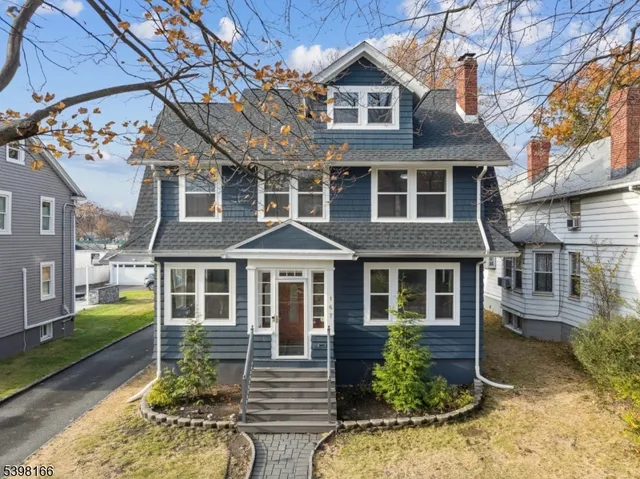 a front view of a house with a porch