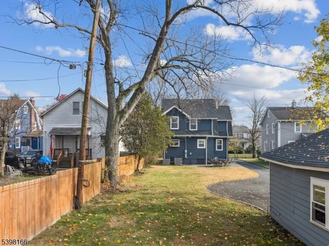an aerial view of residential house with outdoor space and swimming pool