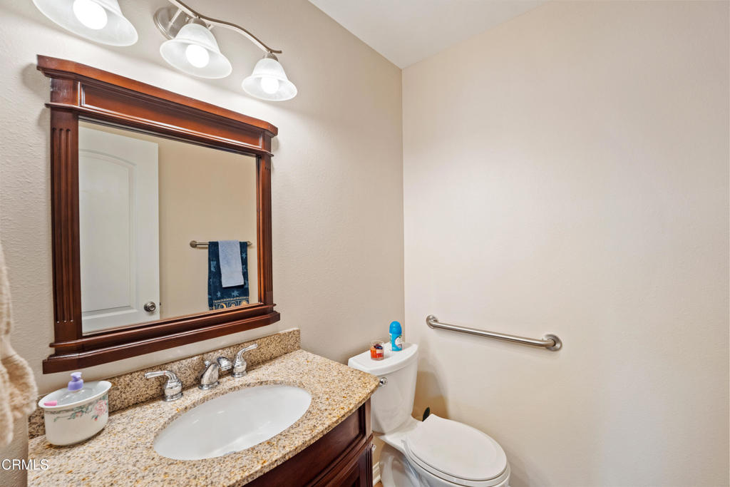 32650 The Old Road Castaic, CA 91384 - Photo 13 of 31 a bathroom with a sink vanity mirror and toilet
