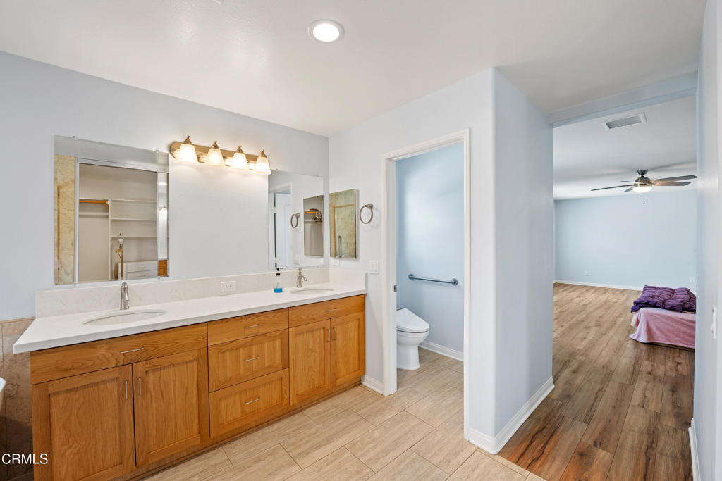 32650 The Old Road Castaic, CA 91384 - Photo 19 of 31 a spacious bathroom with a sink and a mirror