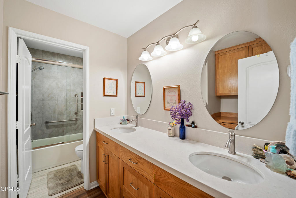 32650 The Old Road Castaic, CA 91384 - Photo 21 of 31 a bathroom with a double vanity sink mirror and double