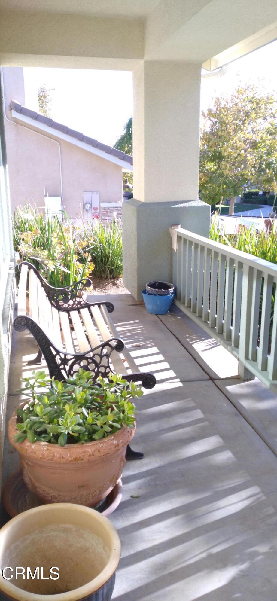 32650 The Old Road Castaic, CA 91384 - Photo 29 of 31 a view of a porch with chairs and potted plants