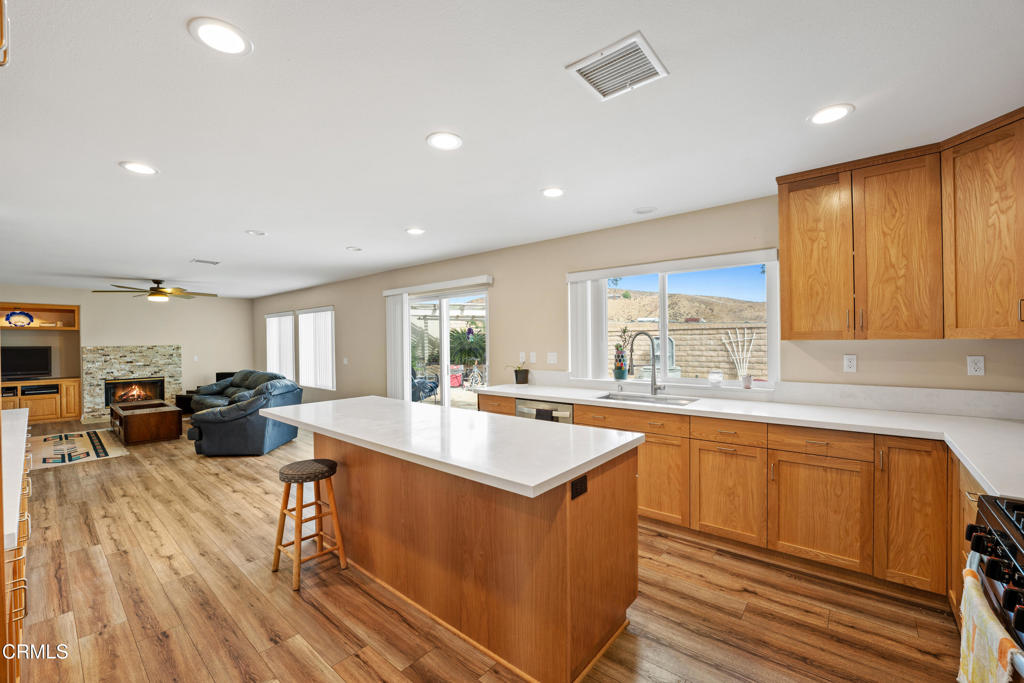 32650 The Old Road Castaic, CA 91384 - Photo 7 of 31 a large kitchen with kitchen island a large window a sink and center island