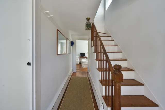 a view of entryway with wooden floor