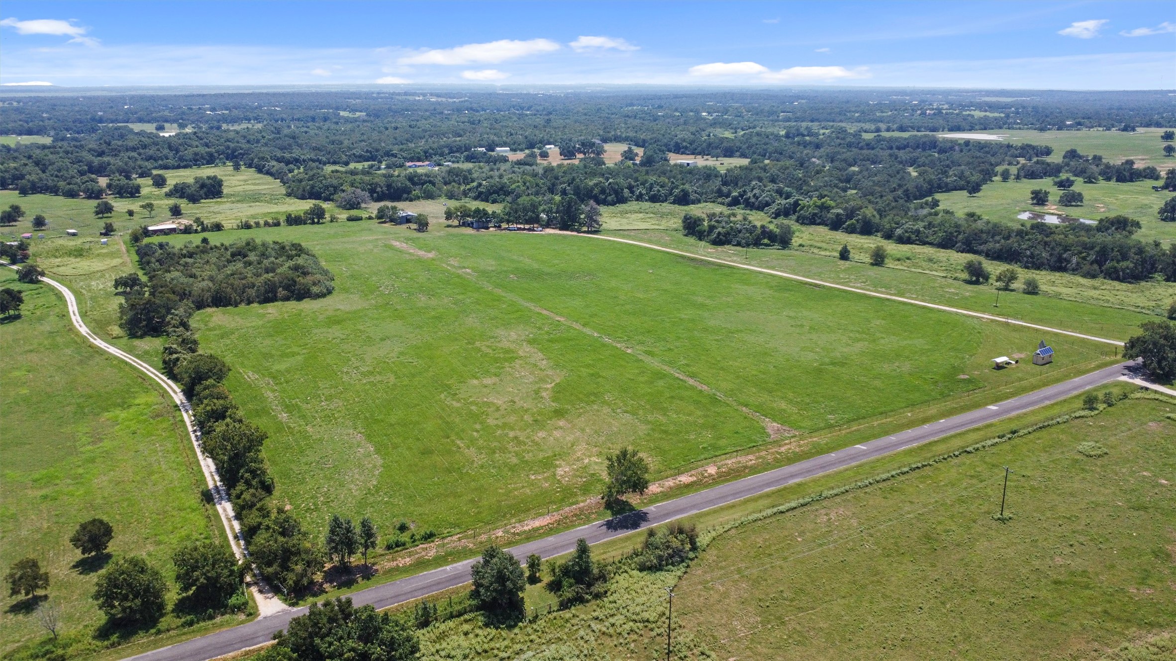 451 Pleasant Grove Road Elgin, TX 78621 - Photo 23 of 26 Aerial view featuring a rural view