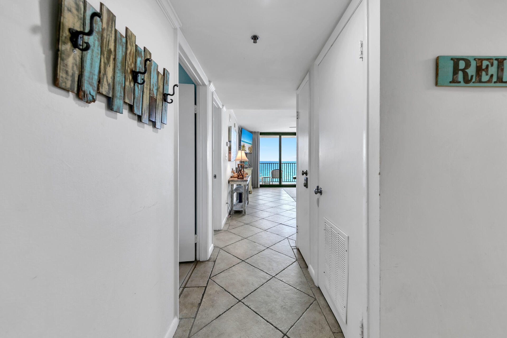 4100 East County Highway 30A, Unit 803 Santa Rosa Beach, FL 32459 - Photo 3 of 34 a view of a hallway with a white walls
