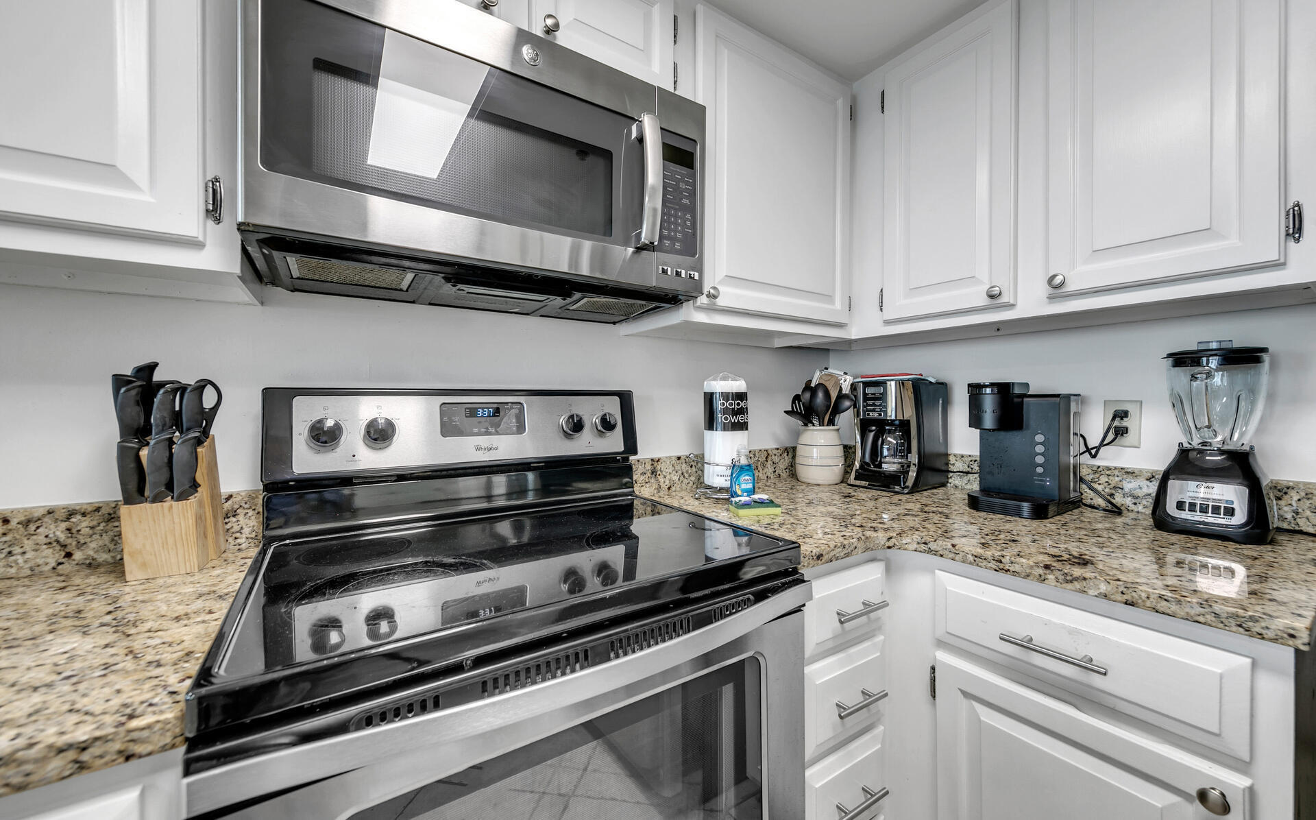 4100 East County Highway 30A, Unit 803 Santa Rosa Beach, FL 32459 - Photo 6 of 34 a kitchen with appliances cabinets and a counter top
