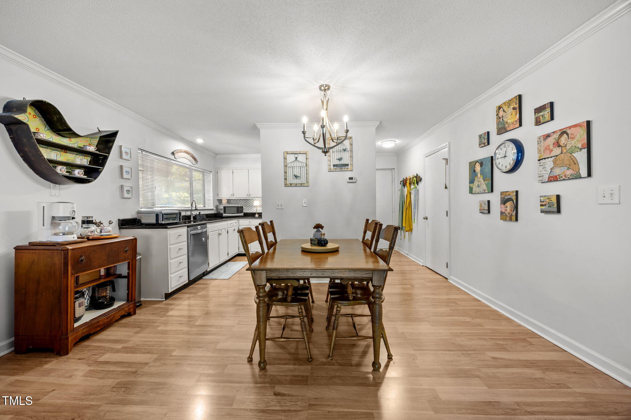 5024 Flint Ridge Place Raleigh, NC 27609 - Photo 11 of 46 a view of a dining room with furniture and wooden floor