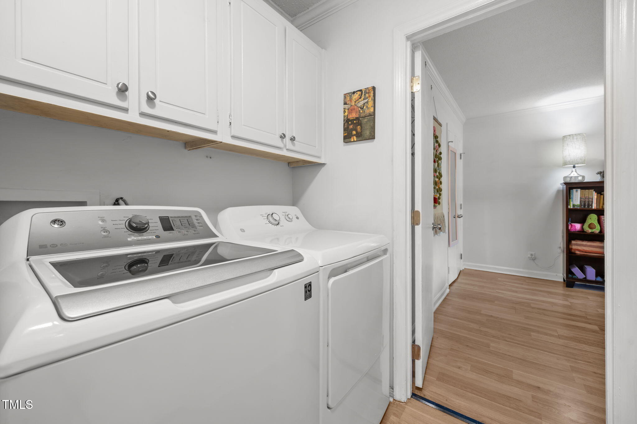 5024 Flint Ridge Place Raleigh, NC 27609 - Photo 26 of 46 a utility room with dryer and washer