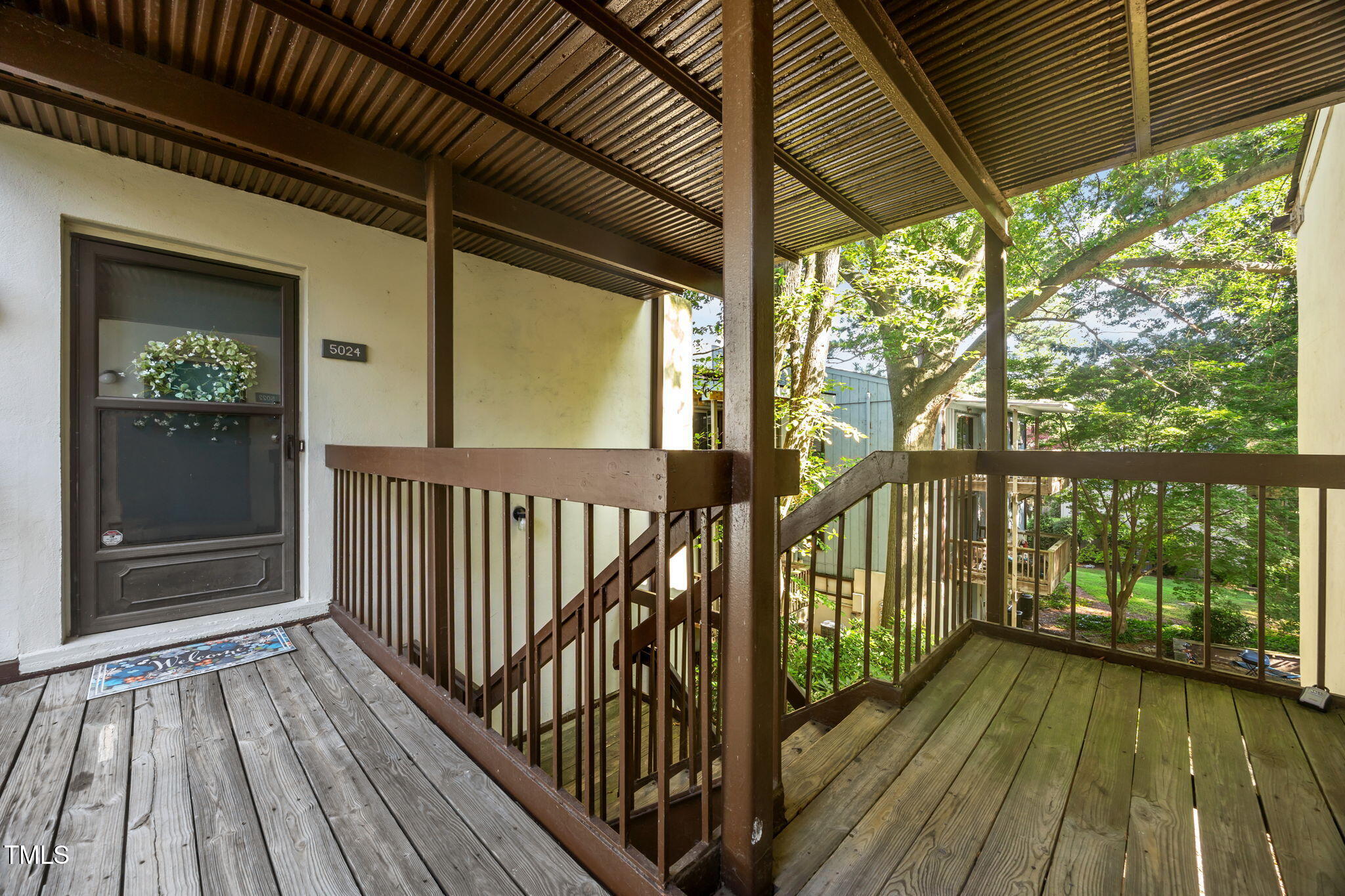 5024 Flint Ridge Place Raleigh, NC 27609 - Photo 2 of 46 a view of balcony with wooden floor
