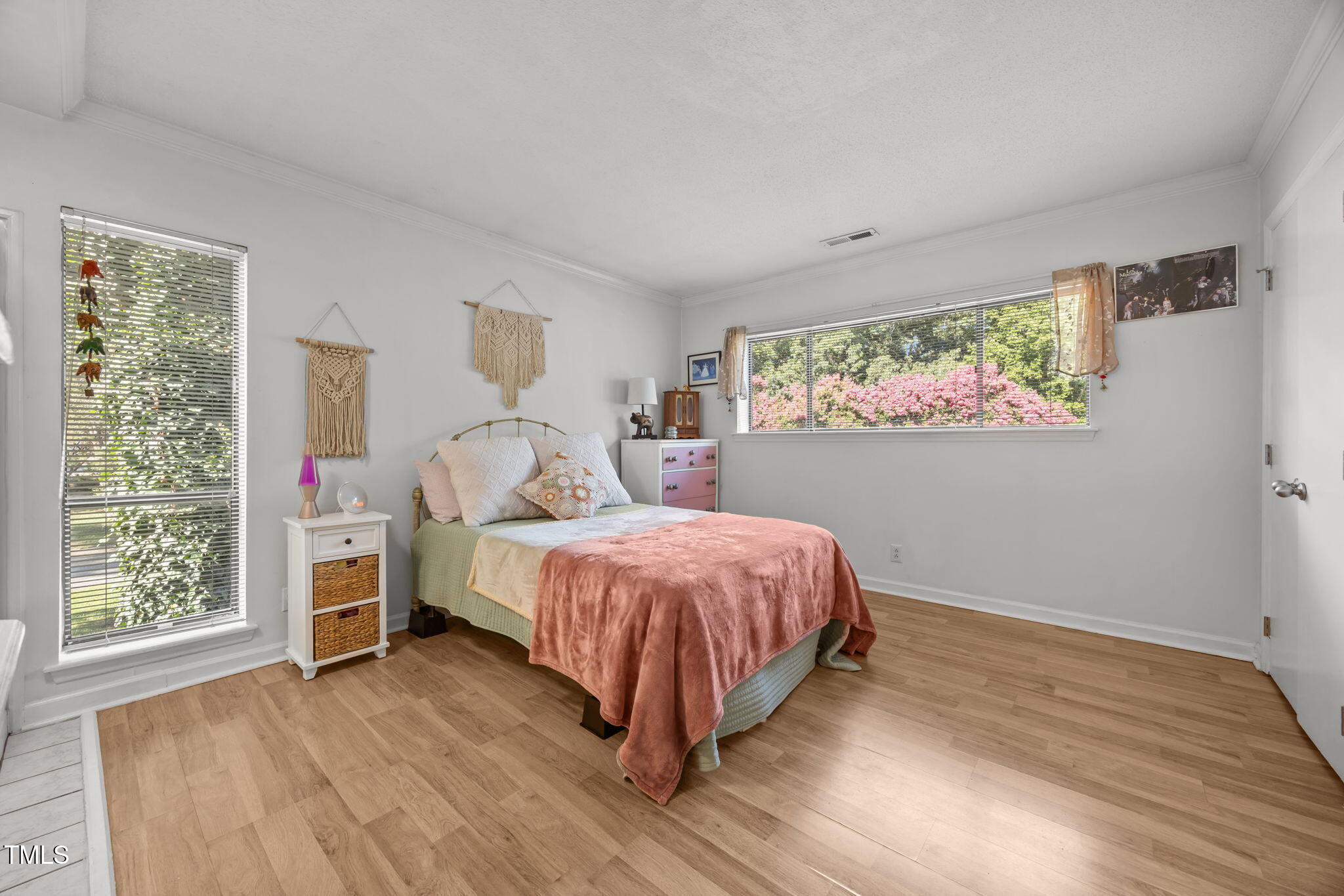 5024 Flint Ridge Place Raleigh, NC 27609 - Photo 30 of 46 a bed room with a bed and a window